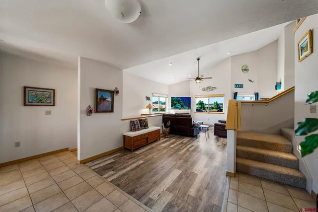 a view of living room filled with furniture and gym equipment