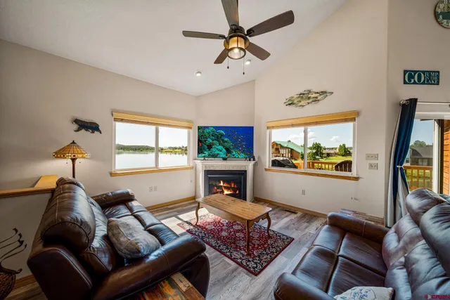 a large white kitchen with a large window