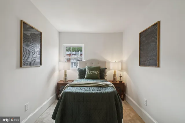 a bedroom with a bed and night stand