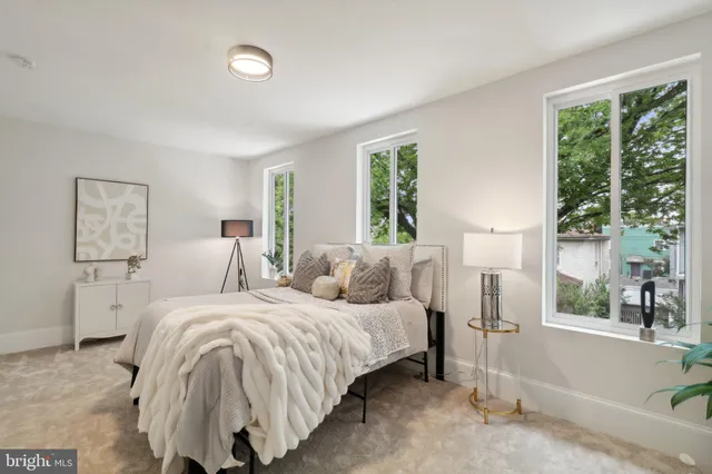 a bedroom with a bed and a view of bathroom