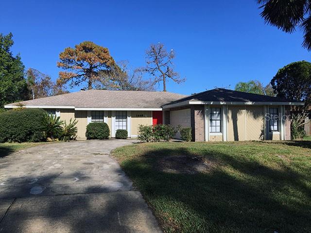 1648 East Normandy Boulevard Deltona, FL 32725 - Photo 1 of 1 a front view of a house with a yard