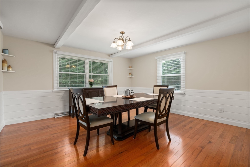 9 Laurel Lane Bellingham, MA 02019 - Photo 14 of 30 a view of a dining room with furniture a chandelier and wooden floor