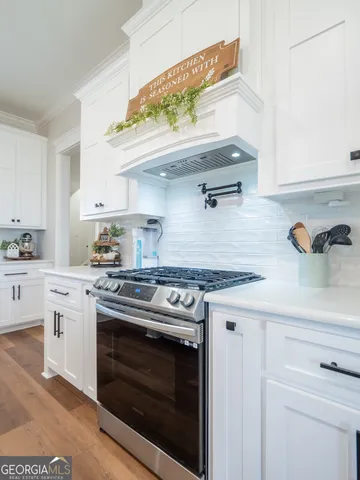 a bathroom with a double vanity sink mirror and shower