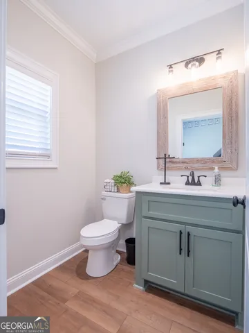 an aerial view of a house with a pool