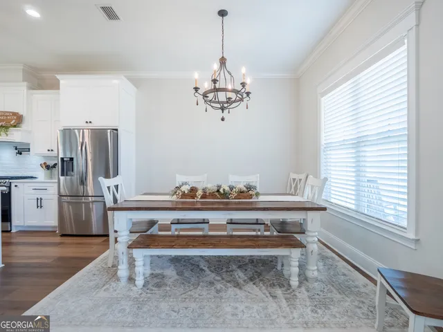 a living room with fireplace furniture and a flat screen tv