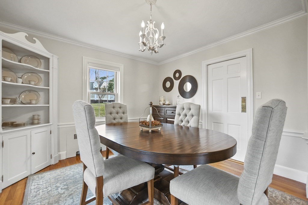 348 Webster Street Needham, MA 02494 - Photo 16 of 42 a view of a dining room with furniture and wooden floor