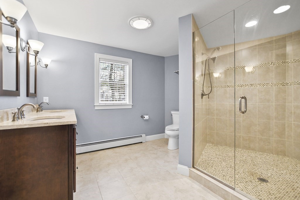 348 Webster Street Needham, MA 02494 - Photo 25 of 42 a bathroom with a sink shower and a toilet