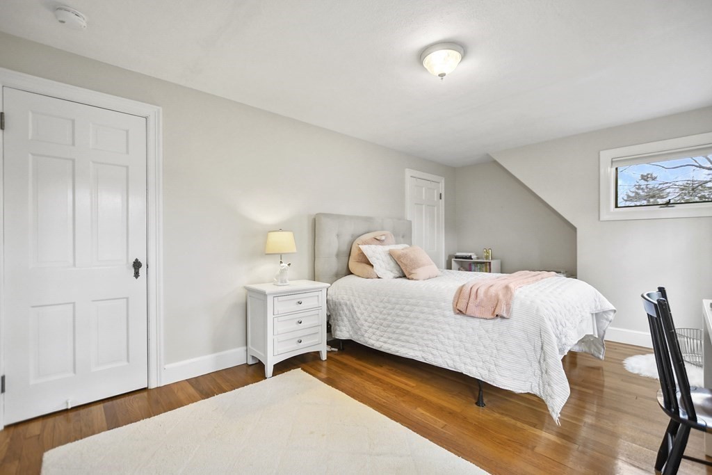 348 Webster Street Needham, MA 02494 - Photo 27 of 42 a bedroom with a bed and a table in it
