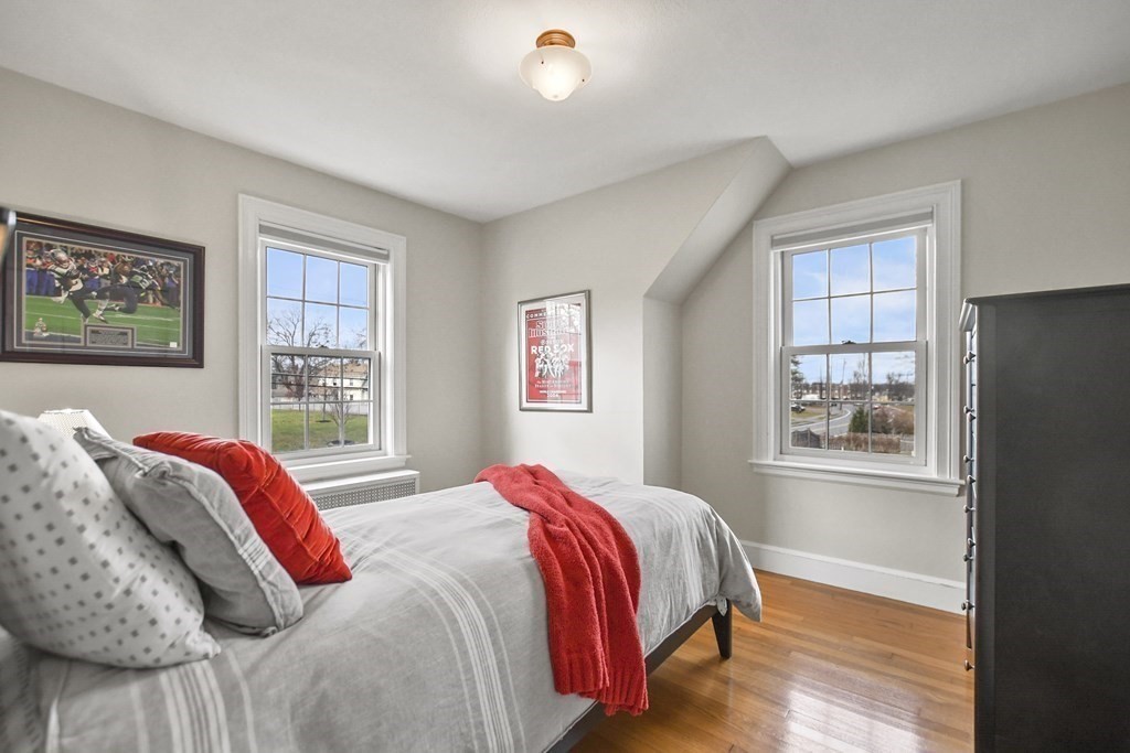 348 Webster Street Needham, MA 02494 - Photo 29 of 42 a bed sitting in a bedroom next to a window