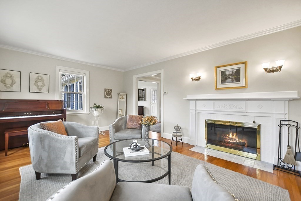 348 Webster Street Needham, MA 02494 - Photo 3 of 42 a living room with furniture and a fireplace