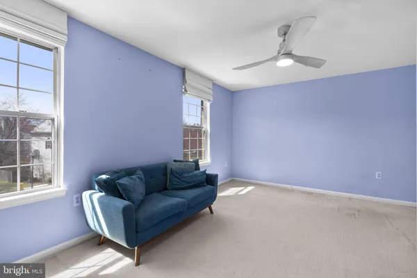a living room with furniture and window