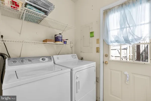a utility room with dryer and washer