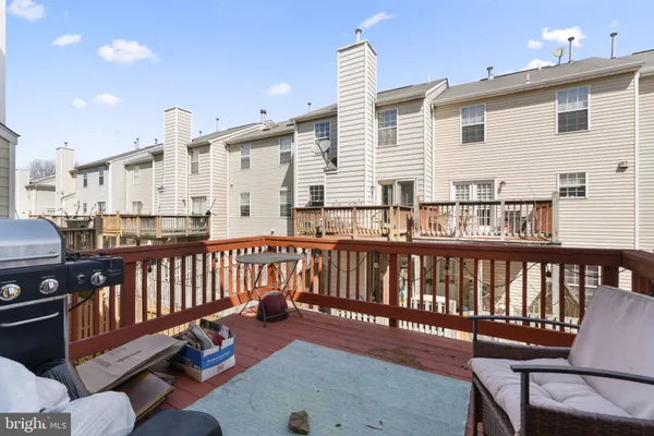 a view of a balcony with furniture