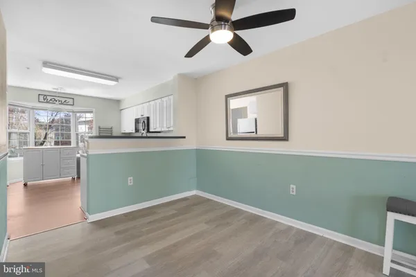 a kitchen with window and cabinets
