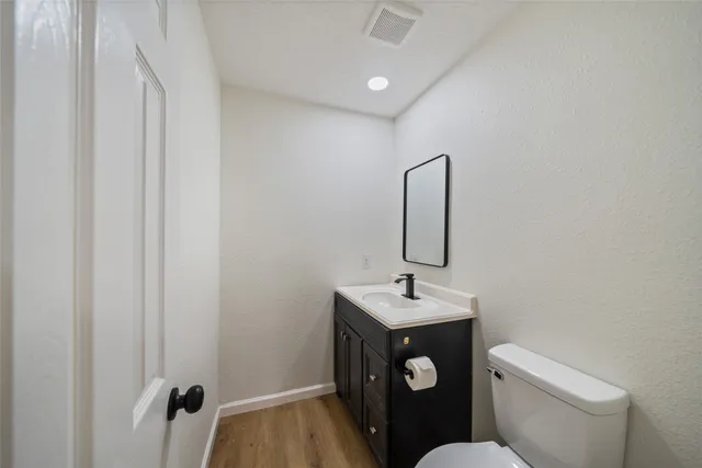 a bathroom with a double vanity sink mirror and bathtub