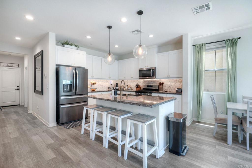 4141 Mission Tree Way Oceanside, CA 92057 - Photo 7 of 29 Easy Care Vinyl Plank Flooring