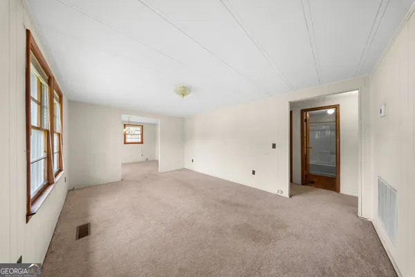 an empty room with windows