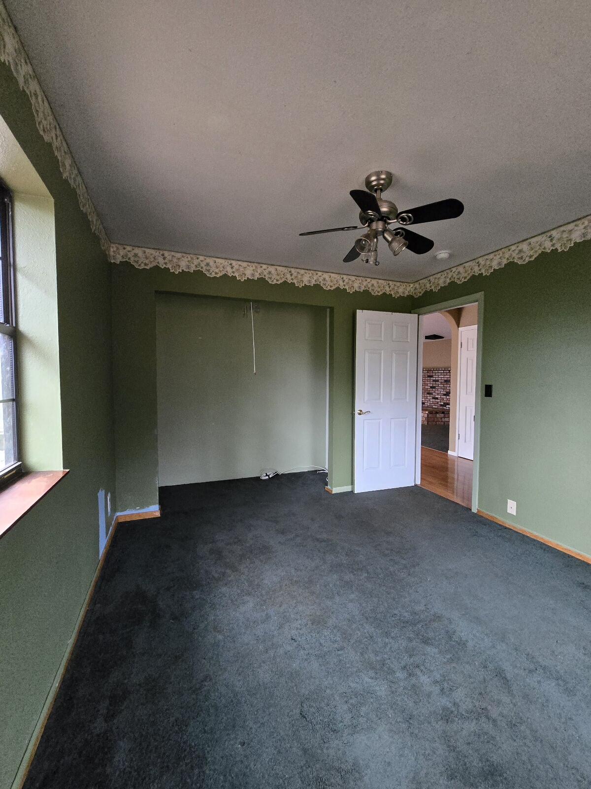 4940 Old Lewiston Road Lewiston, CA 96052 - Photo 21 of 27 a view of a livingroom with a ceiling fan and window