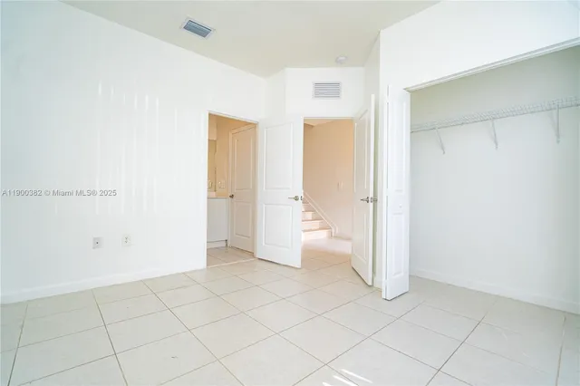 a view of a livingroom with a staircase