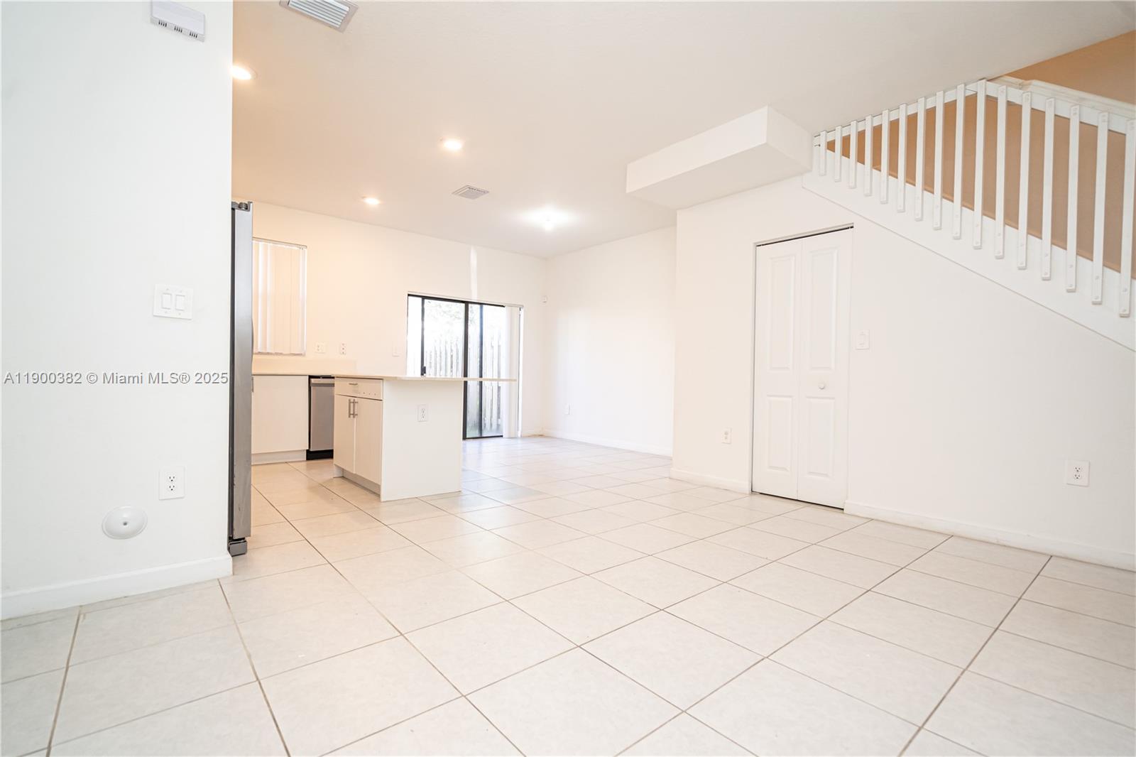 13237 Southwest 286th Street, Unit 13237 Homestead, FL 33033 - Photo 17 of 48 a view of a livingroom with a staircase
