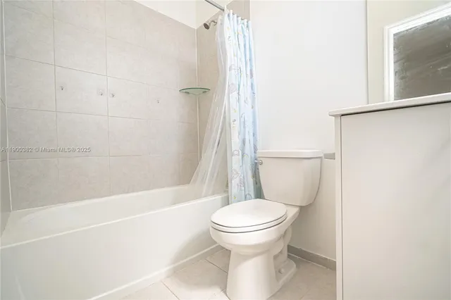 a view of a hallway with wooden shelves