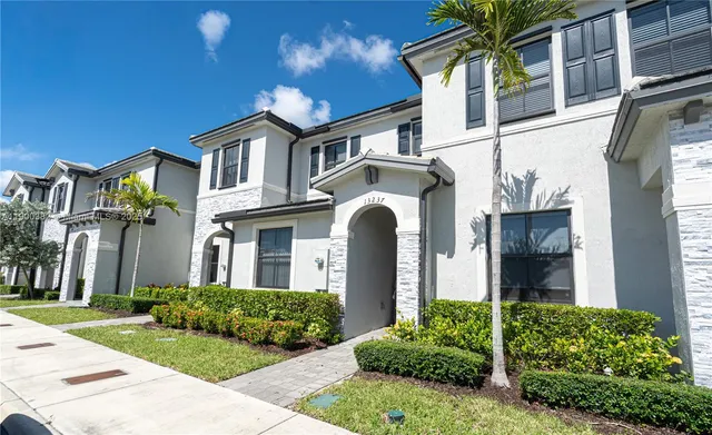 a view of a city with an ocean view