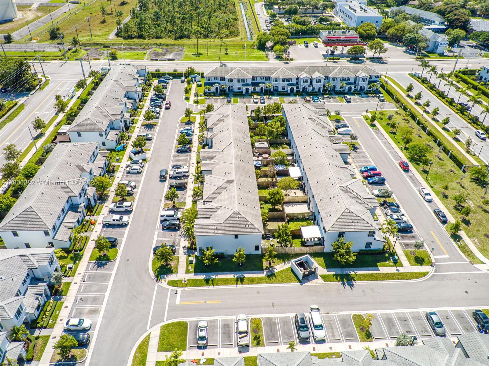 13237 Southwest 286th Street, Unit 13237 Homestead, FL 33033 - Photo 45 of 48 an aerial view of swimming pool and outdoor space