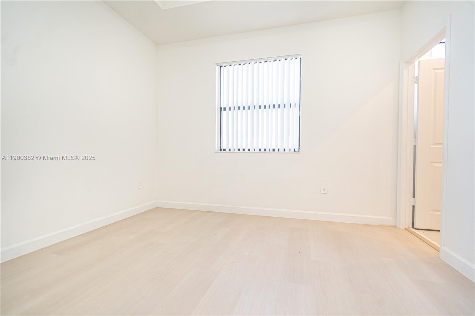 13237 Southwest 286th Street, Unit 13237 Homestead, FL 33033 - Photo 6 of 48 an empty room with a window