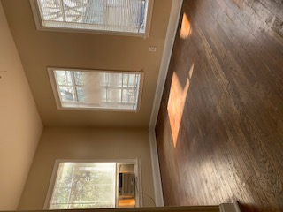 1105 Bentwood Road, Unit B Austin, TX 78722 - Photo 1 of 9 Unfurnished room with plenty of natural light, dark wood-style floors, and cooling unit