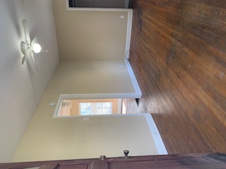 1105 Bentwood Road, Unit B Austin, TX 78722 - Photo 6 of 9 Unfurnished room featuring ceiling fan and dark wood-type flooring