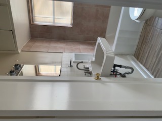 1105 Bentwood Road, Unit B Austin, TX 78722 - Photo 7 of 9 Full bath with tile walls, bathtub / shower combination, and healthy amount of natural light