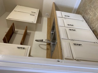 1105 Bentwood Road, Unit B Austin, TX 78722 - Photo 8 of 9 Kitchen with open shelves, white cabinetry, and light countertops