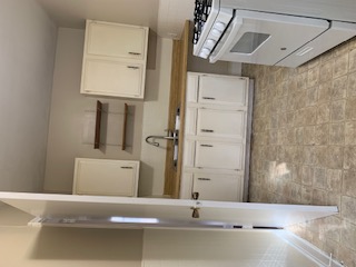 1105 Bentwood Road, Unit B Austin, TX 78722 - Photo 9 of 9 Kitchen featuring range, white cabinets, and open shelves