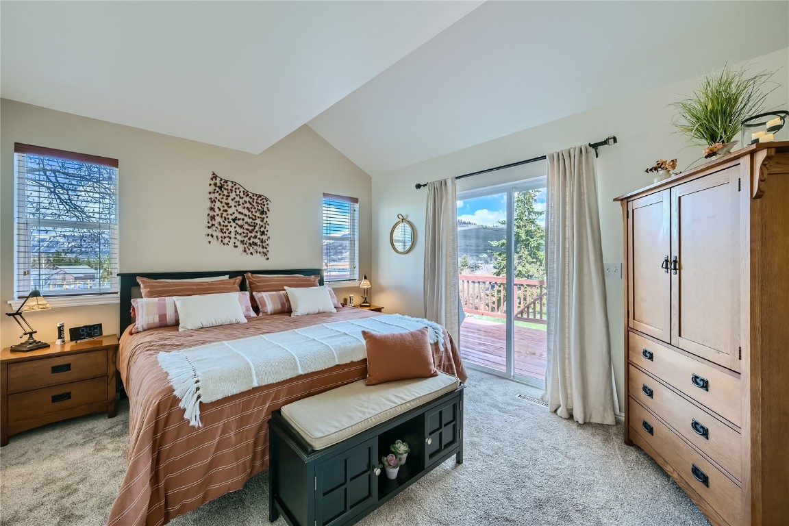 852 Alpine Road Dillon, CO 80435 - Photo 11 of 29 a bedroom with a large bed and a window