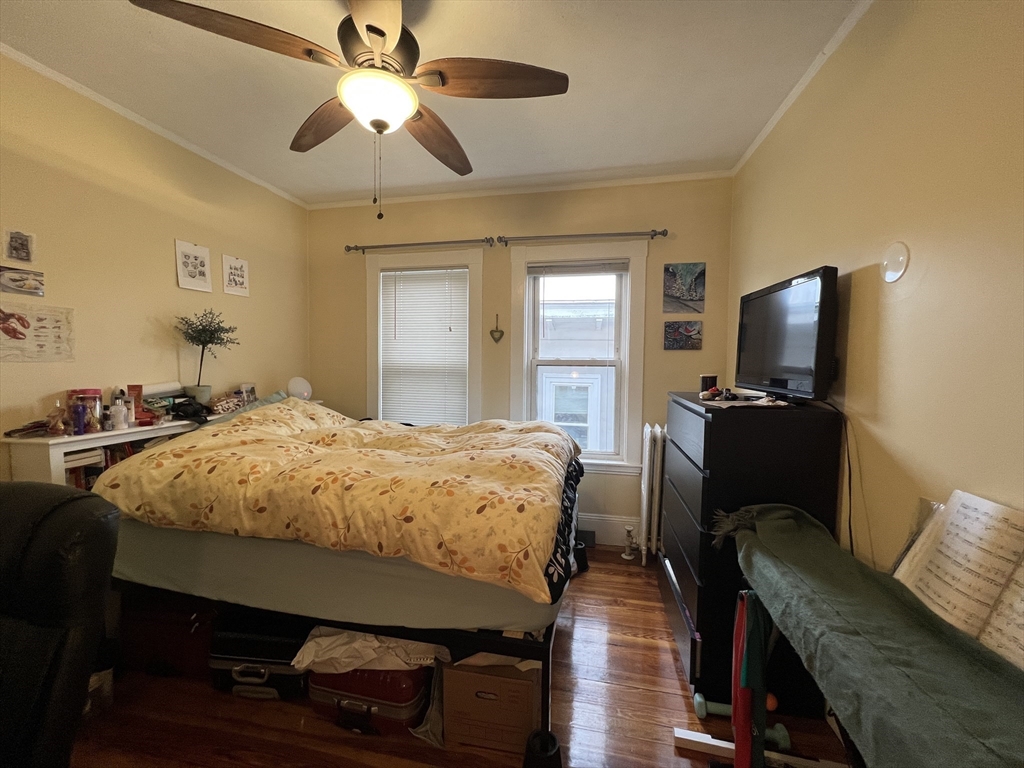 121 Liberty Road, Unit 3 Somerville, MA 02144 - Photo 17 of 24 a bed room with a bed and a television