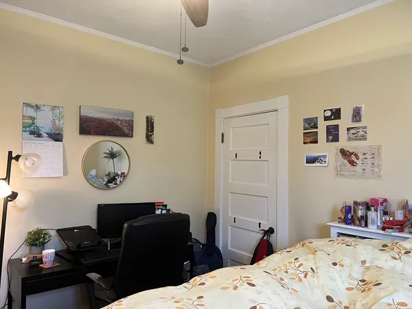 a bedroom with a bed and dresser