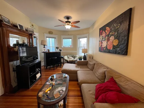 a living room with furniture and a flat screen tv