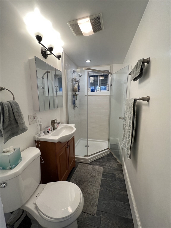 121 Liberty Road, Unit 3 Somerville, MA 02144 - Photo 22 of 24 a bathroom with a sink toilet and shower