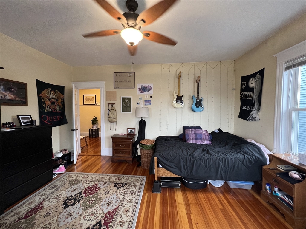121 Liberty Road, Unit 3 Somerville, MA 02144 - Photo 7 of 24 a living room with furniture and a wooden floor