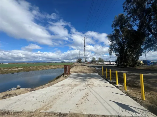 a view of ocean with large house
