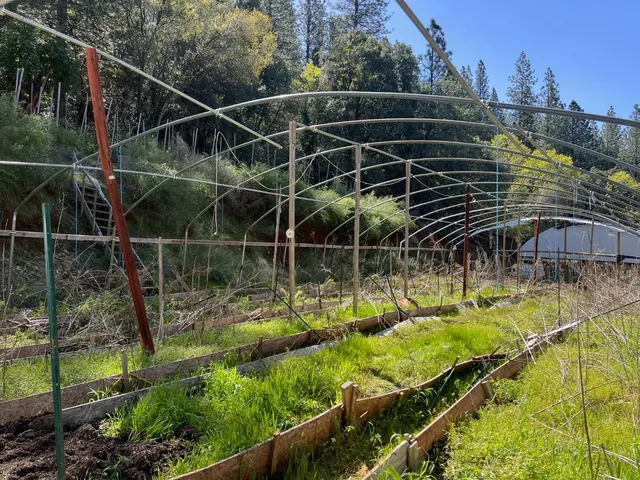 a view of yard with swimming pool and sitting area