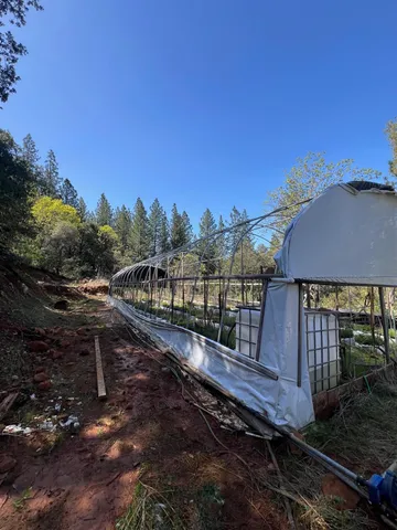 a view of a wooden fence and a yard