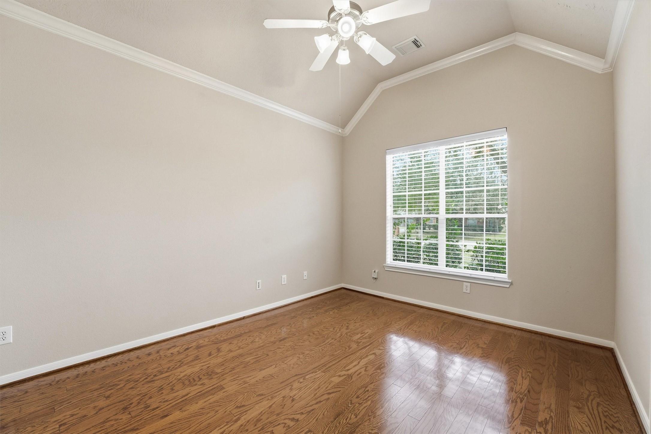 17415 Memorial Mills Drive Spring, TX 77379 - Photo 12 of 39 A first-floor study or flex room features hardwood flooring, crown molding, and a large window providing natural light.