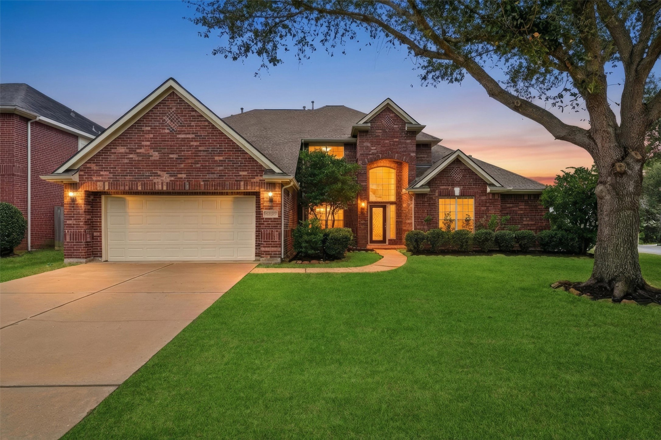 17415 Memorial Mills Drive Spring, TX 77379 - Photo 2 of 39 Same front elevation. (Virtual twilight image to highlight the wonderful evening curb appeal.)