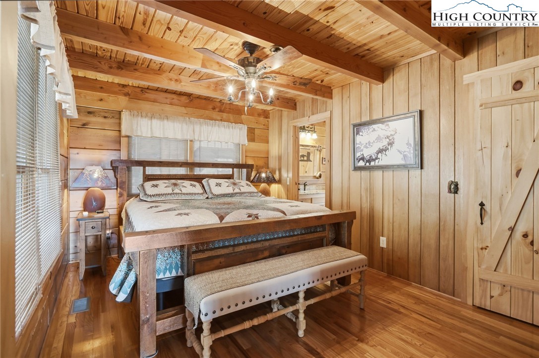 130 Hawkbill Road Ferguson, NC 28624 - Photo 13 of 50 a bedroom with a bed and a table