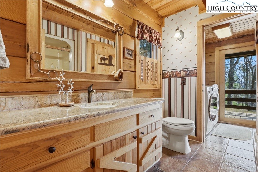 130 Hawkbill Road Ferguson, NC 28624 - Photo 15 of 50 a bathroom with a granite countertop sink toilet and shower