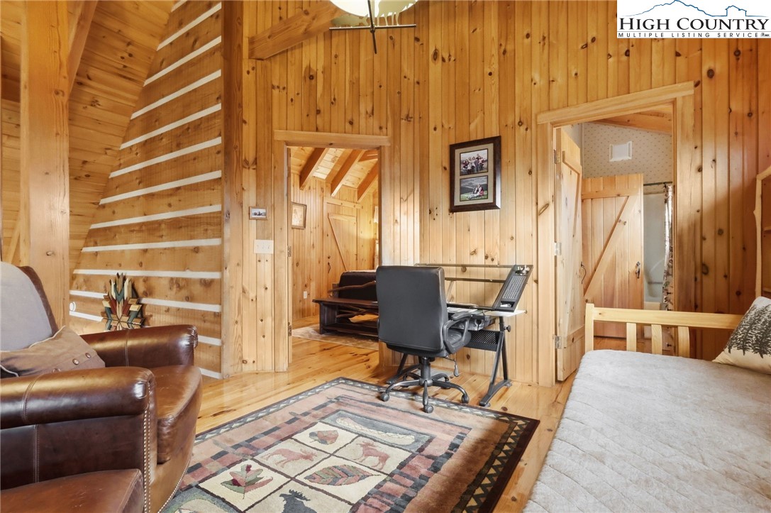 130 Hawkbill Road Ferguson, NC 28624 - Photo 17 of 50 a living room with furniture a wooden floor and next to a window