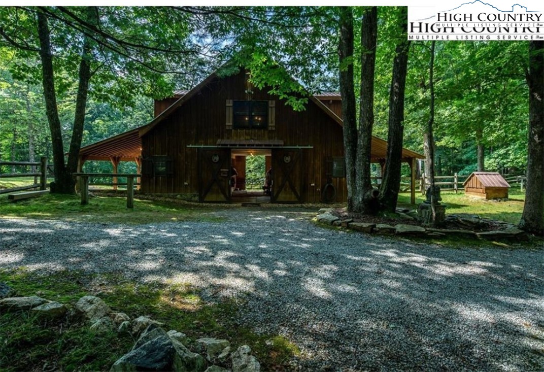 130 Hawkbill Road Ferguson, NC 28624 - Photo 21 of 50 a view of a house with a yard