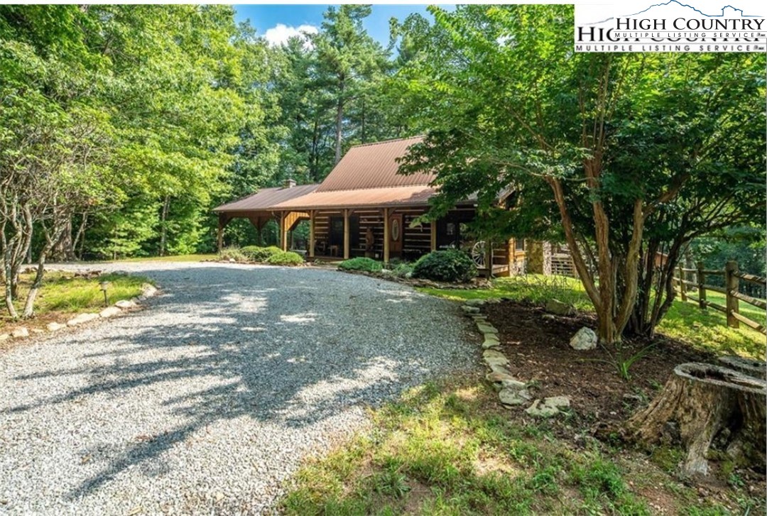 130 Hawkbill Road Ferguson, NC 28624 - Photo 3 of 50 a view of a house with a yard