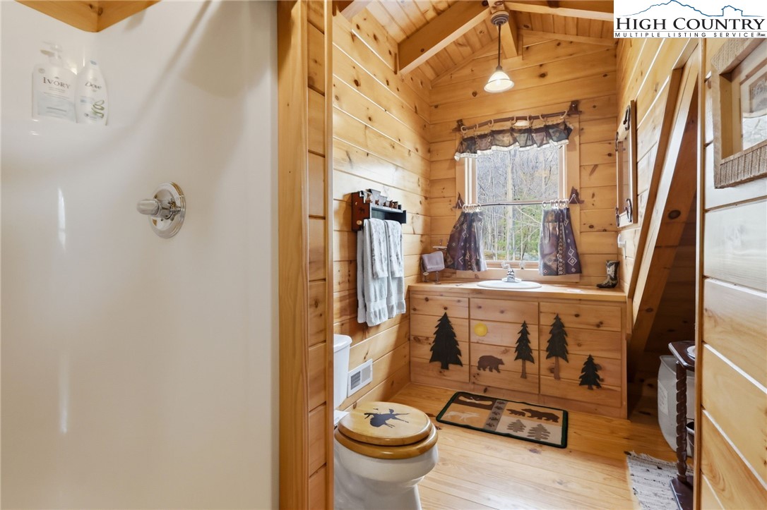130 Hawkbill Road Ferguson, NC 28624 - Photo 33 of 50 a bathroom with a toilet sink and mirror